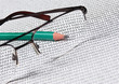 glasses and  pencil