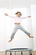 Girl jumping on trampoline