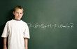 Boy standing in front of the mathematical solution