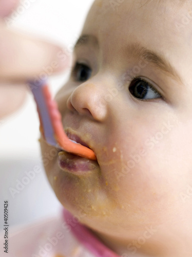 Photo: Baby being fed with baby food Baby being fed with baby food