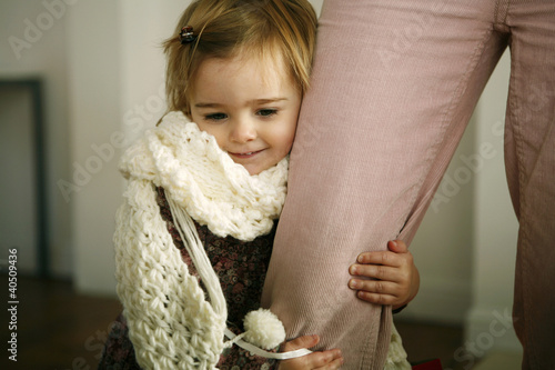Photo: Girl hugging her mother's leg Girl hugging her mother's leg