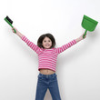 Girl holding a dustpan and a brush