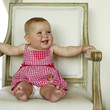 Cute baby sitting on a chair