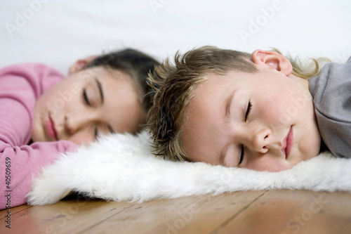 Photo: Children sleeping on the floor Children sleeping on the floor