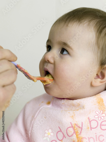 Photo: Baby being fed with baby food Baby being fed with baby food