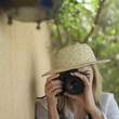 Professional female photographer taking picture