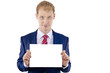 Happy smiling young business man showing blank signboard, isolat