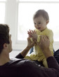 Photo : Father playing with baby girl Father playing with baby girl