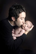 Father kissing baby