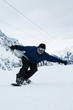 A man snowboarding