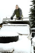 Man climbing on the top of jeep