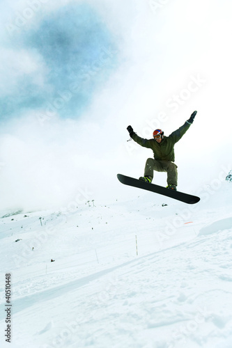 Photo: Male snowboarder in air Male snowboarder in air