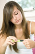 Girl filing her fingernails
