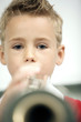 Boy blowing a trumpet