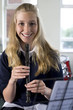 Girl playing recorder in music room