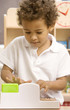 Boy playing with toy cash register