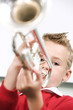 Boy blowing a trumpet