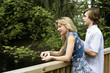 Man and woman on the bridge at the park
