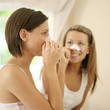 Women using pore strips