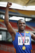 Man with gold medal celebrating his success