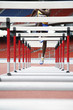 Man jumping over hurdles
