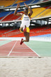 Man performing long jump