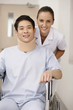 Nurse pushing patient on wheelchair