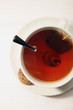 A cup of tea with biscuit at the side