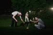 Three men searching for missing golf ball