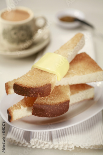 Photo: Slices of toast bread with butter Slices of toast bread with butter