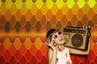 Woman carrying radio on her shoulder