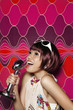 Woman singing into vintage microphone