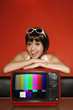 Woman posing with television