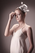 Woman with flower and hat decorating her hair