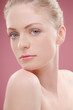 Woman posing with her chin on shoulder