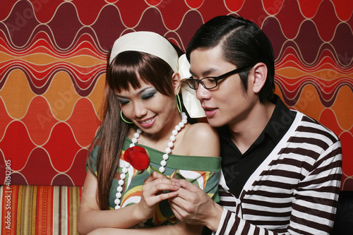 Photo: Man giving woman red rose Man giving woman red rose