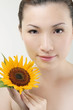 Woman posing with sunflower