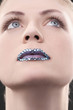 Woman with rhinestones on her lips