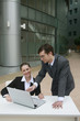 Businessman giving explanation to businesswoman