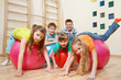 Kids on  gymnastic balls