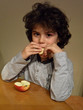 Curly child eating an apple 3