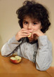 Curly child eating an apple 2