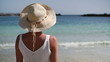 Video: Woman in summer hat standing on beautiful tropical beach Woman in summer hat standing on beautiful tropical beach