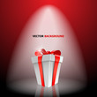 Gift box with red bow on light Gift box with red bow on light