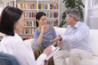 couple arguing during therapy session with psychologist