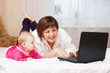 mother and baby with notebook mother and baby with notebook