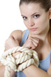 young woman with tied up hands over white