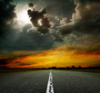 paved road at sunset