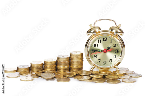 Photo: Alarm clock and money isolated on white background Alarm clock and money isolated on white background