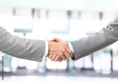 Foto: handshake isolated on business background handshake isolated on business background